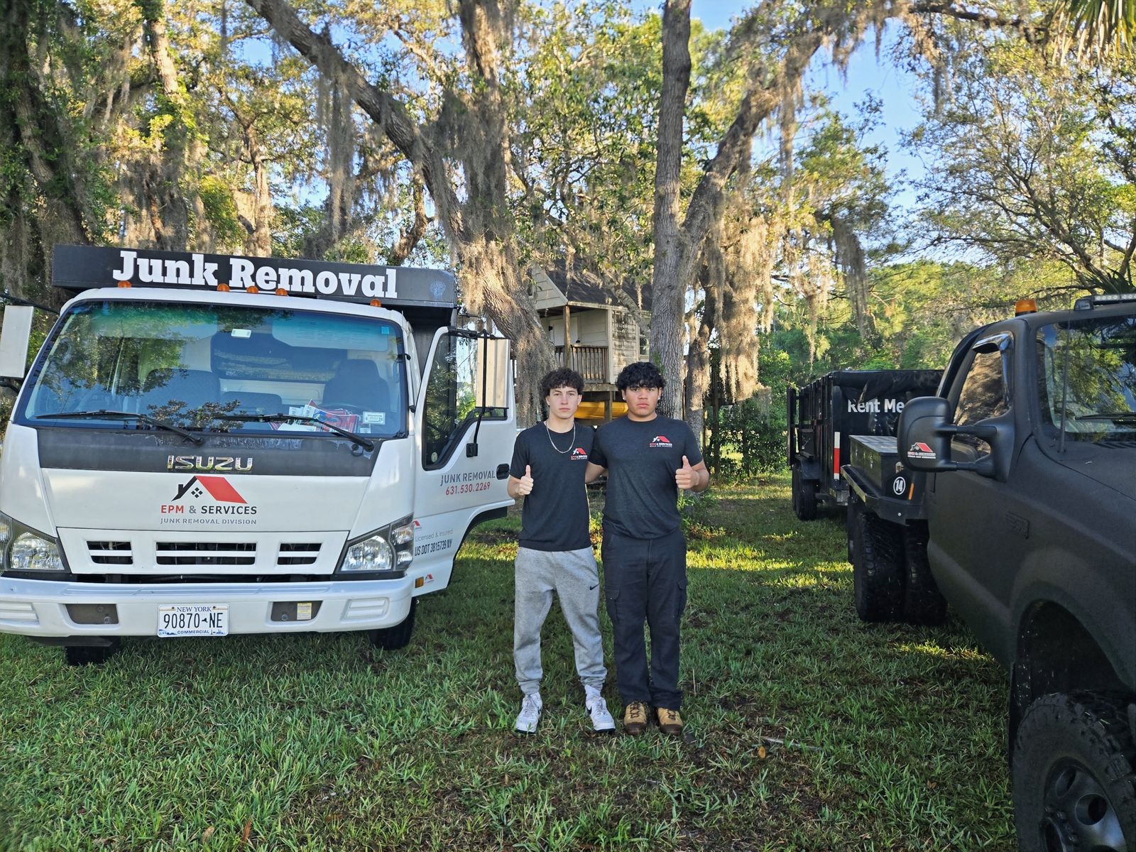 EPM & Services junk removal crew and trucks in Eustis, Florida EPM & Services junk removal crew and trucks in Eustis, Florida