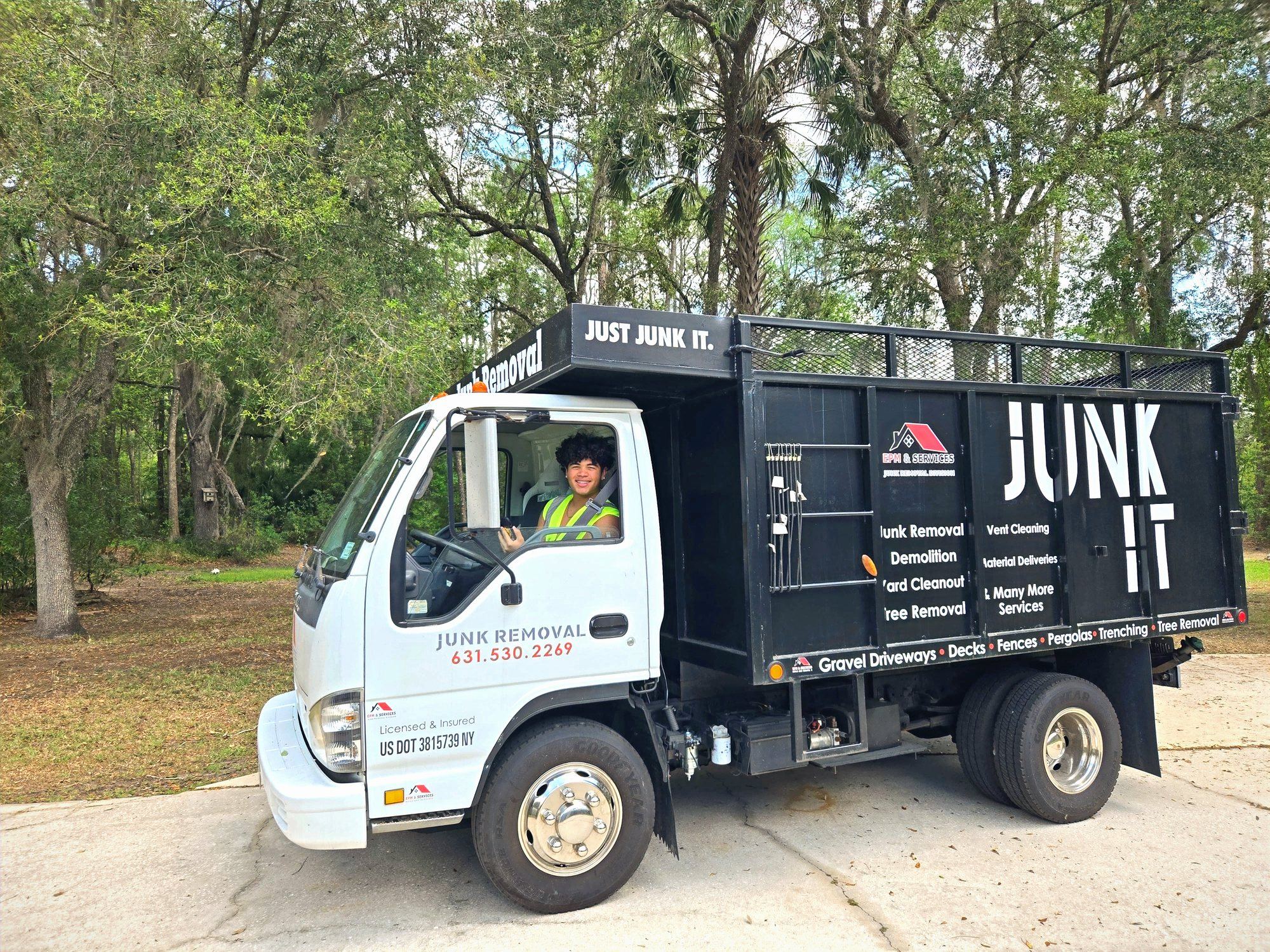 Junk removal truck serving Eustis, FL and Lake County EPM & Services junk removal truck branded for junk removal Eustis, FL